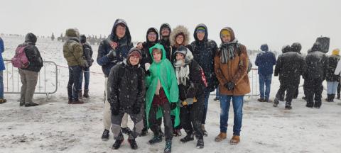 People posing during a snowstorm